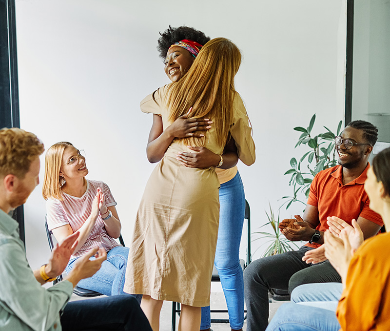 A group of people participate in group therapy at a Bowling Green drug rehab.